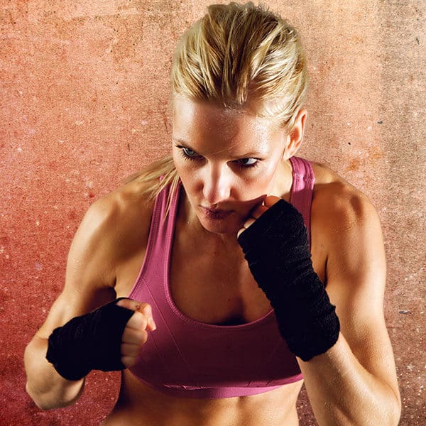 Mixed Martial Arts Lessons for Adults in Clinton Township MI - Lady Kickboxing Focused Background