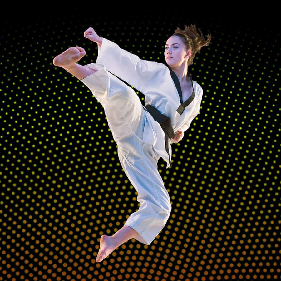 Martial Arts Lessons for Adults in Clinton Township MI - Girl Black Belt Jumping High Kick